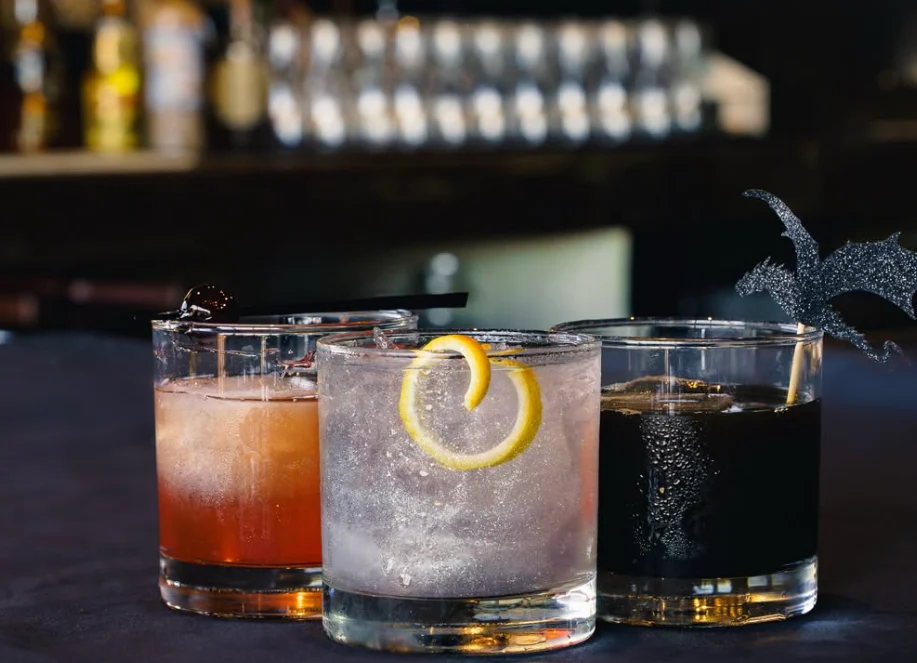 Three freshly crafted cocktails on the bar